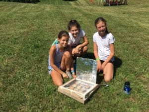 Girl Scouts use solar oven to bake cinnamon rolls
