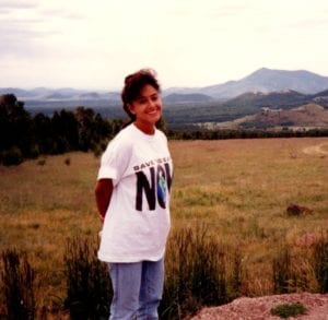 Kim Lundgren in high school wearing a "Save the Earth" shirt