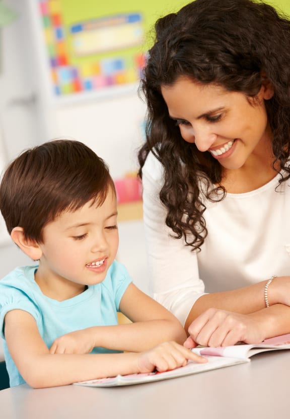 child and mom doing a workbook