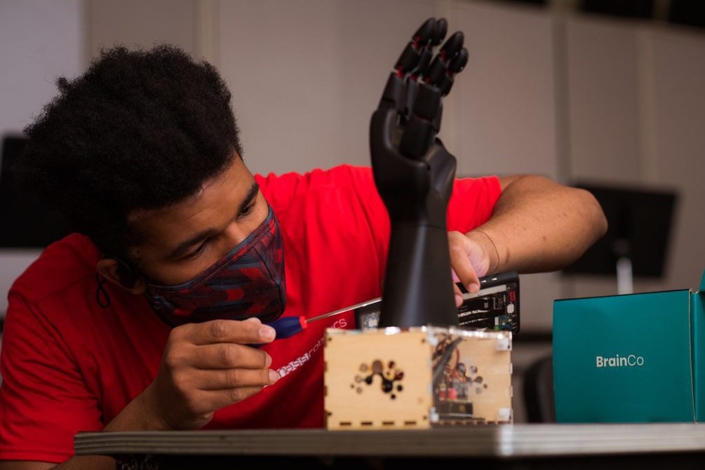 Student works on NeuroMaker prosthetic hand