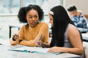 teen girl tutoring a student