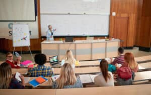 college lecture hall with professor and students