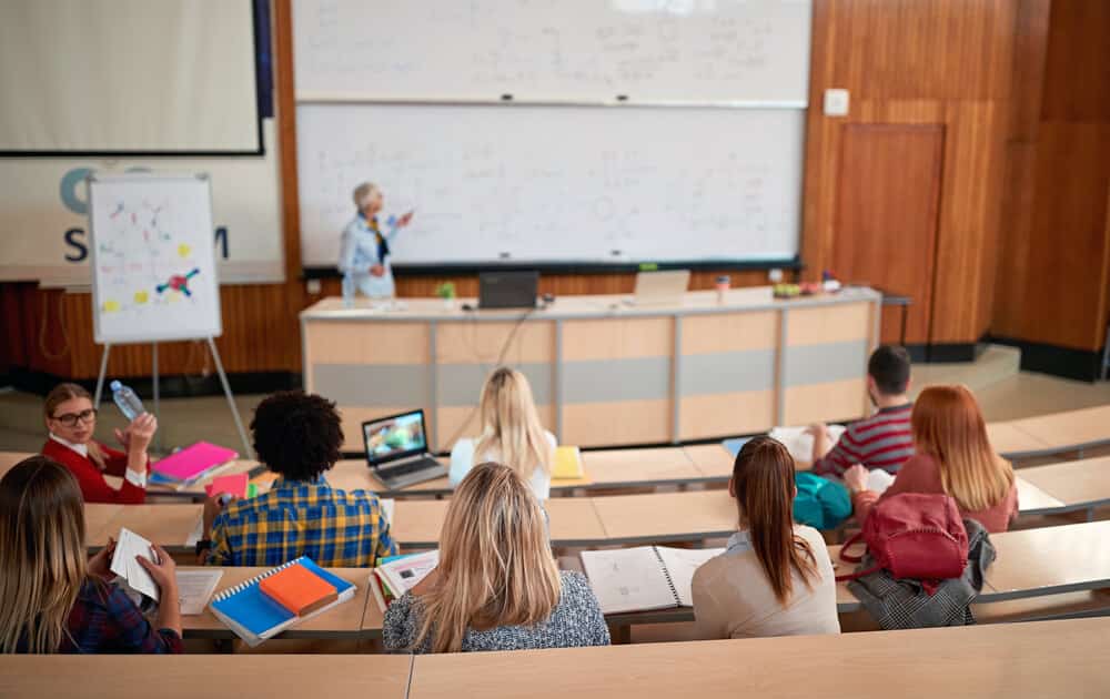 college lecture hall with professor and students