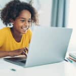 smiling girl on a laptop