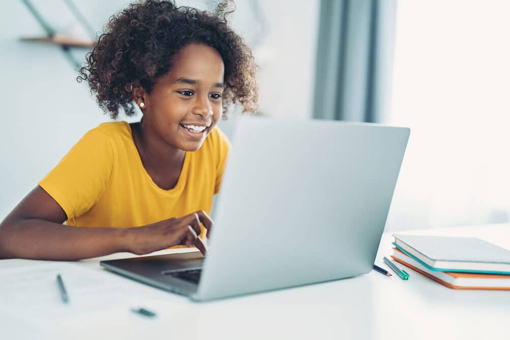 smiling girl on a laptop