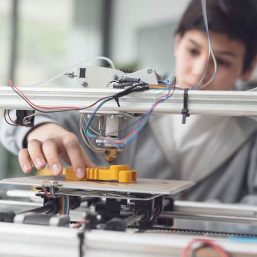 Boy printing a prototype