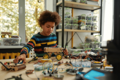 teen boy builds robot